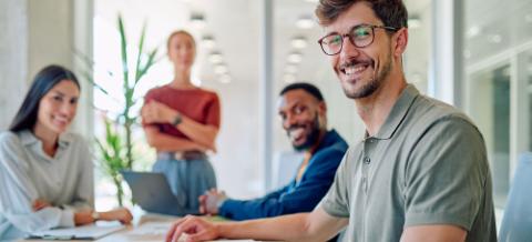 Business team collaborating on a project, analyzing data, and developing innovative strategies in a bright, modern office space