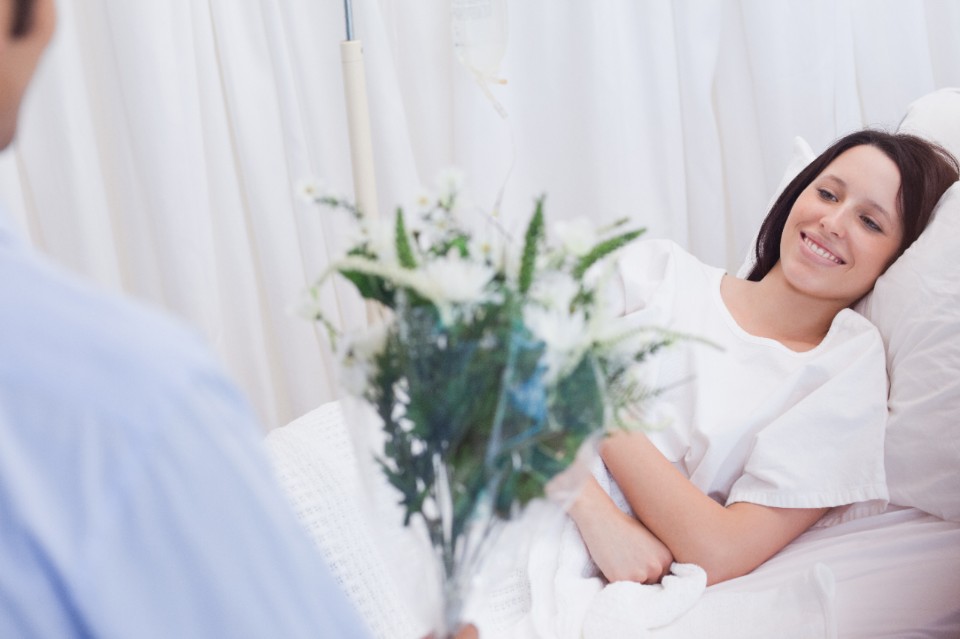 Female patient getting flowers